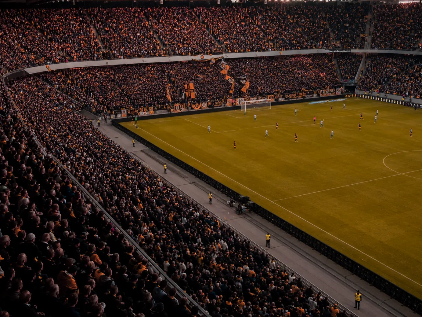 Täysi katsomo espanjalaisella jalkapallostadionilla iltavalaistuksessa